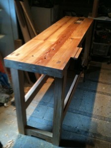 Shows the loos plywood tongues used to join the top and the ebony inlay in the vice.